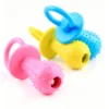 Pacifier-shaped toy with a bell