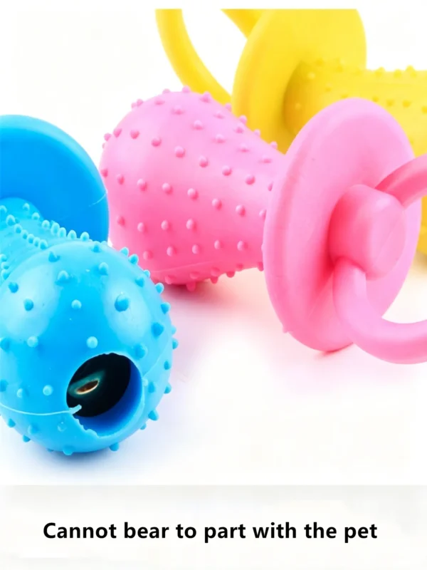 Pacifier-shaped toy with a bell